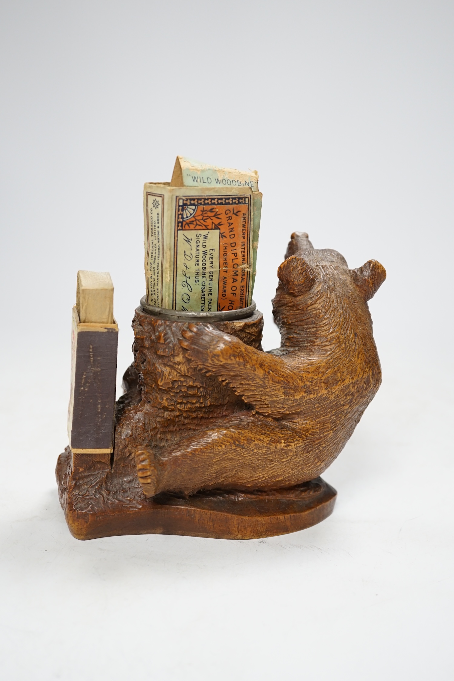 A carved Black Forest bear matchbox holder, 13cm high